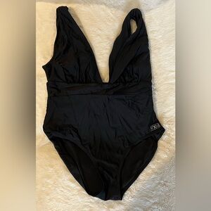 Vixxon by Dixxon women’s one piece deep V bathing suit. Good condition. Large.